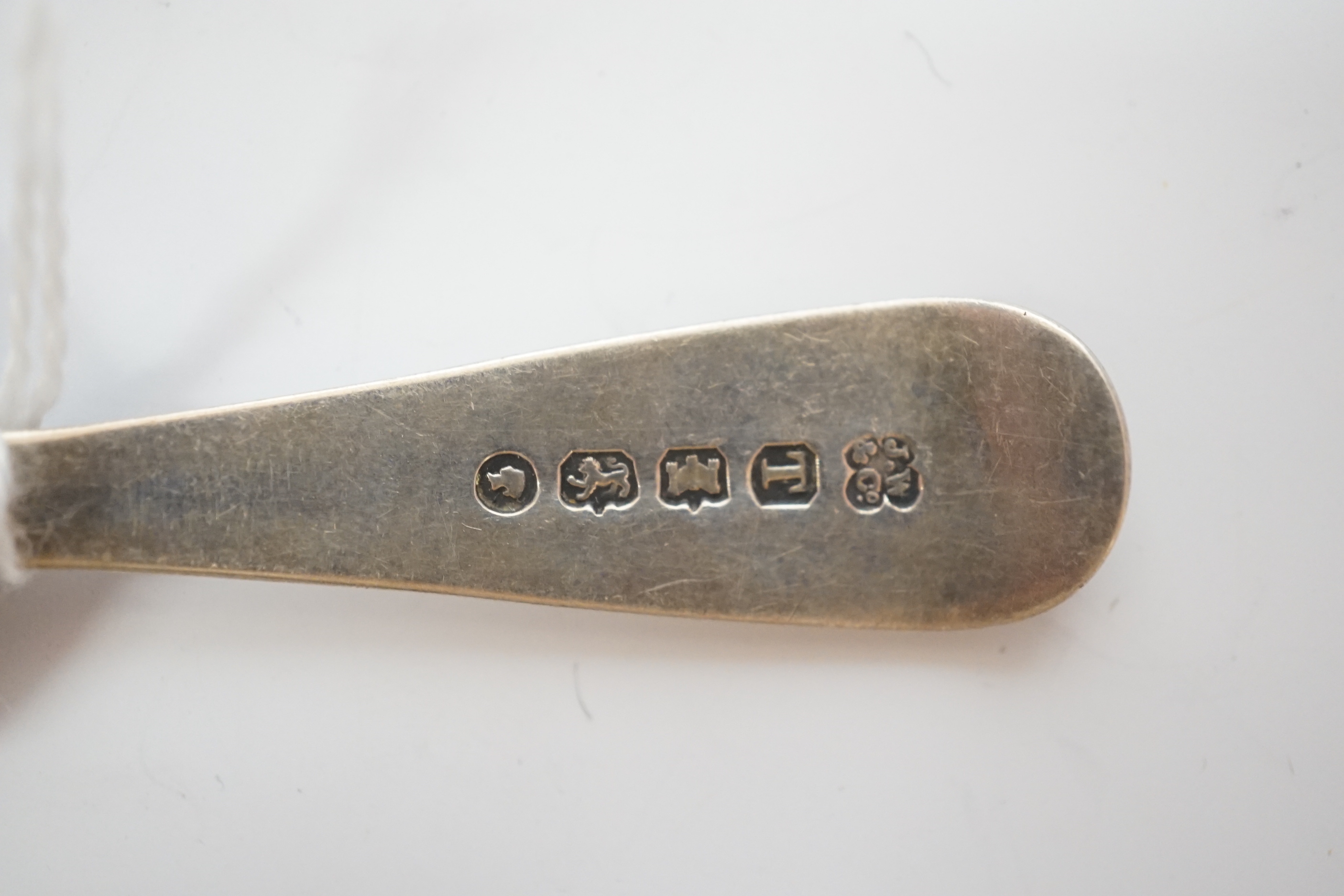 A cased set of six silver teaspoons and tongs and four other assorted silver or white metal spoons, including a caddy spoon.